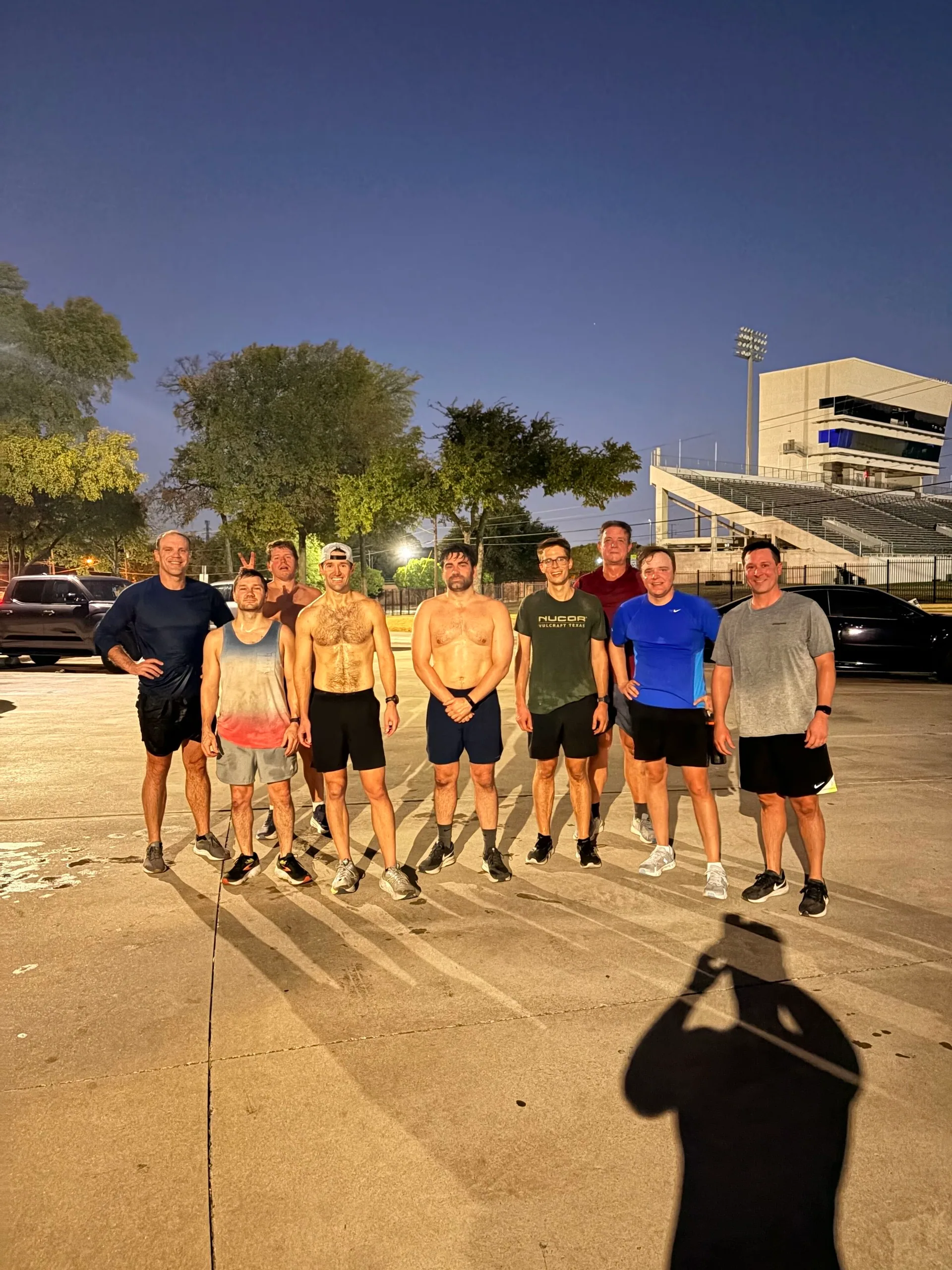 F3 Dallas members gathered beside the stadium bleachers