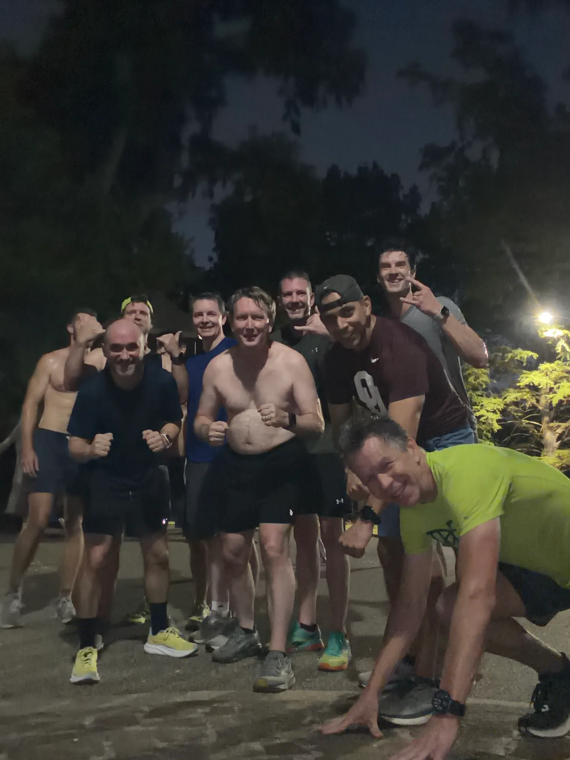 F3 Dallas group posing together outdoors at night